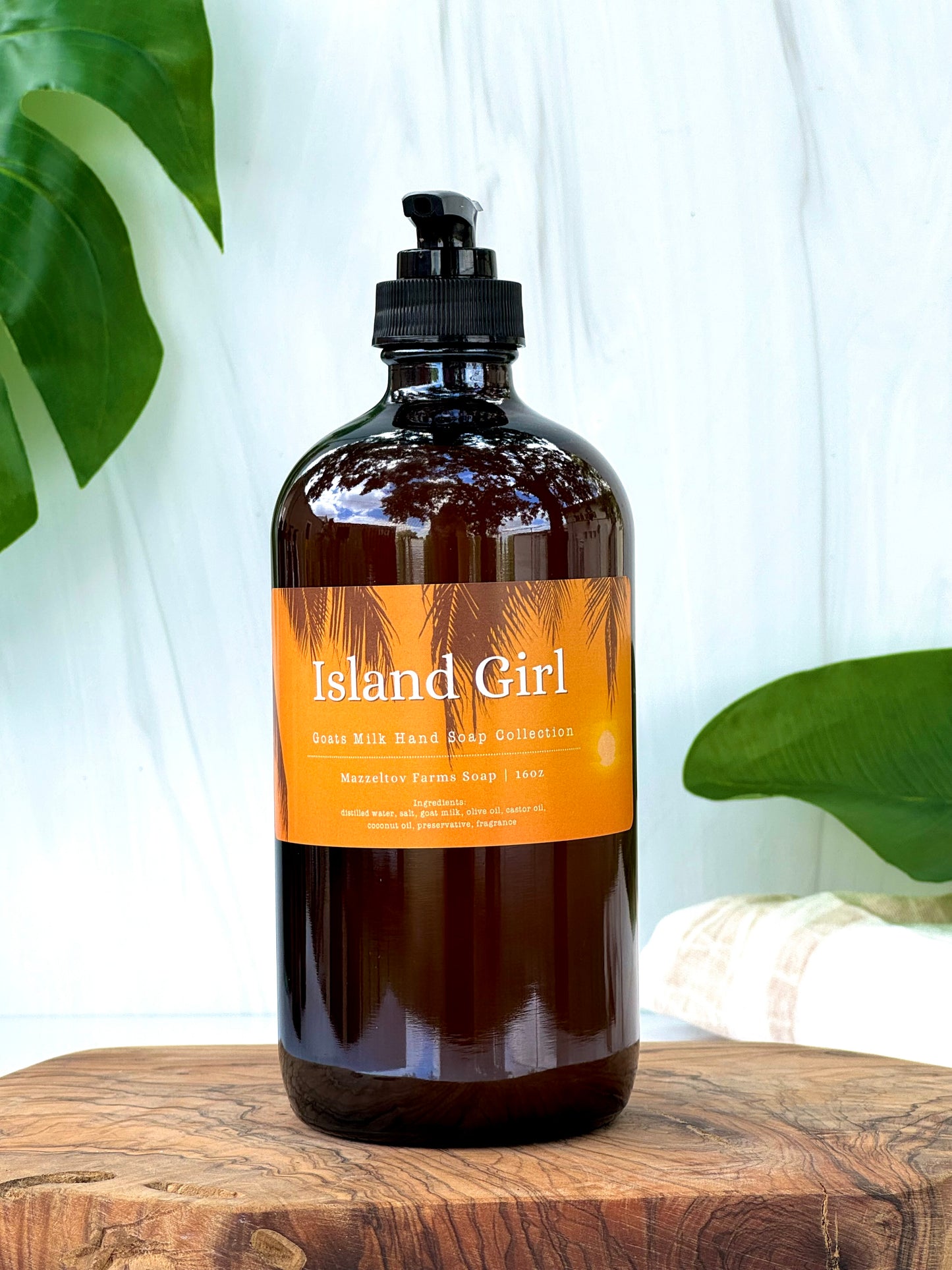 Island Girl goat milk liquid hand soap in amber glass pump bottle, tropical fruity scented natural hand soap