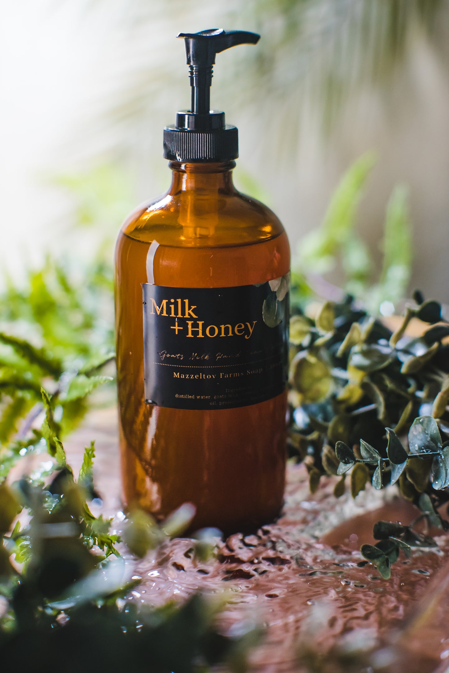 16 oz Milk and Honey goat milk liquid hand soap by Mazzeltov Farms Soap Co. Amber glass pump bottle with creamy honey scent, handmade with real goat milk.