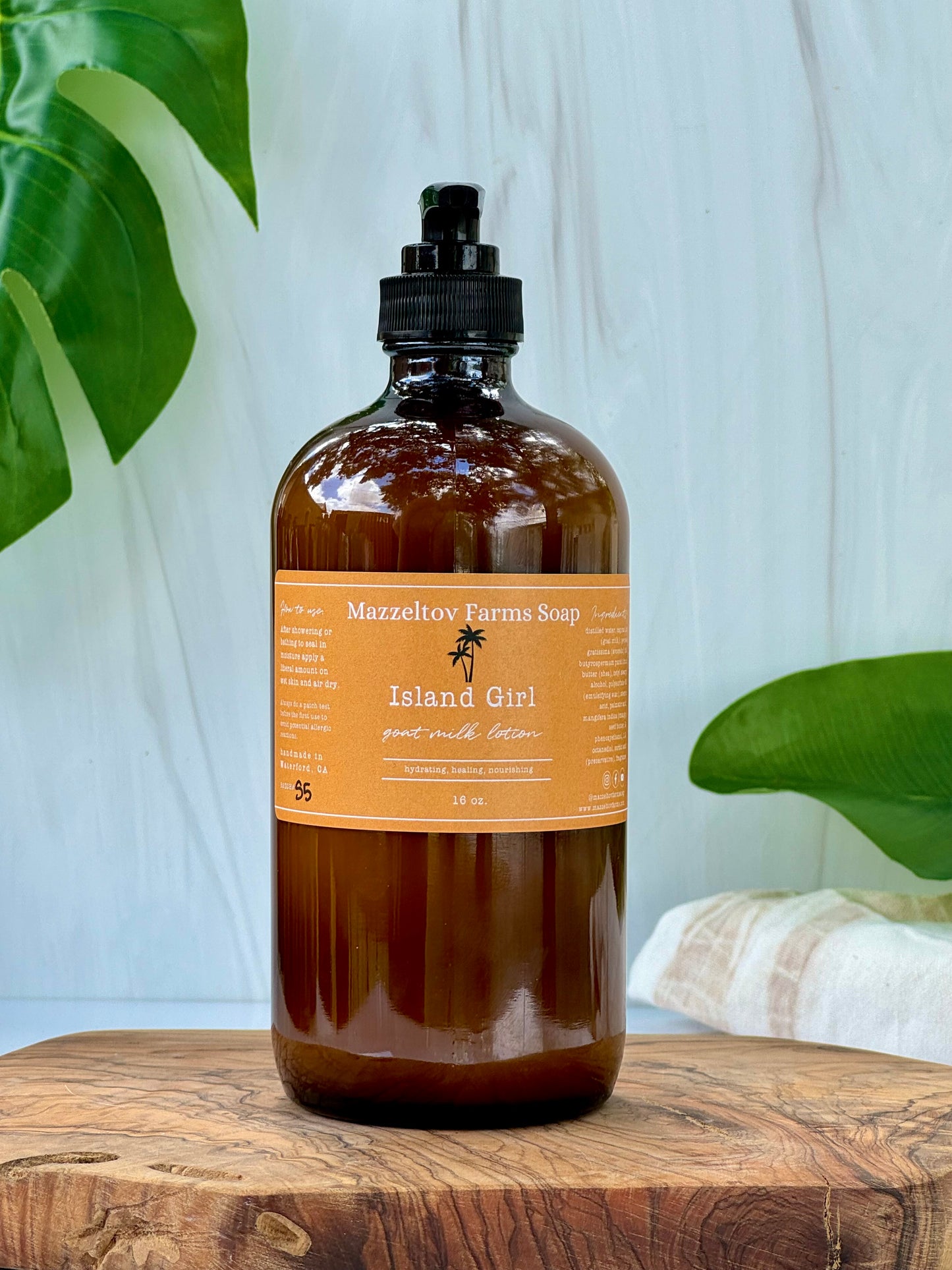 Island Girl goat milk lotion in 16 oz amber glass pump bottle, tropical fruity scented natural body lotion