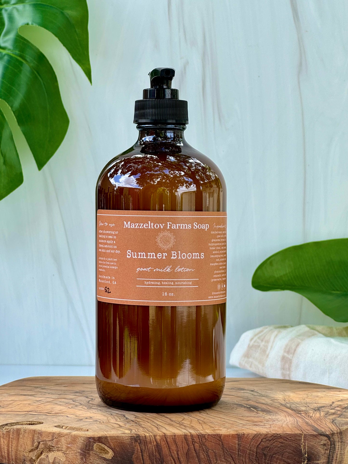Summer Blooms goat milk lotion in 16 oz amber glass pump bottle, fruity floral scented natural body lotion
