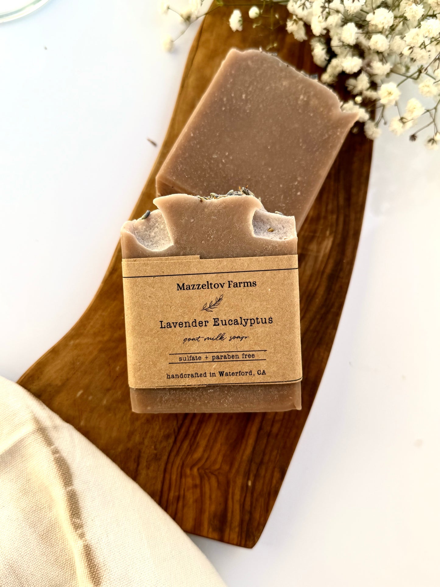 Lavender Eucalyptus goat milk soap bar handmade by Mazzeltov Farms Soap Co. Purple and cream bar with lavender buds, naturally colored with Purple Brazilian Clay and scented with essential oils.