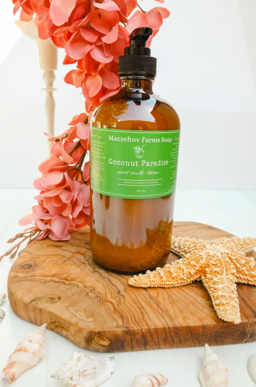 Coconut Paradise goat milk lotion in 16 oz amber glass pump bottle, coconut scented natural body lotion with coastal fragrance