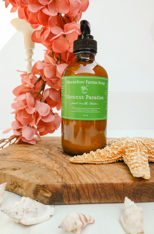 Coconut Paradise goat milk lotion in 8 oz amber glass pump bottle, coconut scented natural body lotion with coastal fragrance