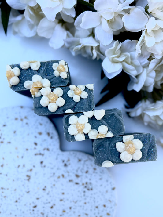 Blue Jean Baby goat milk bar soap by Mazzeltov Farms Soap Co. Floral spring scent with lily, freesia, citrus, and soft musk, handmade with goat milk and activated charcoal.