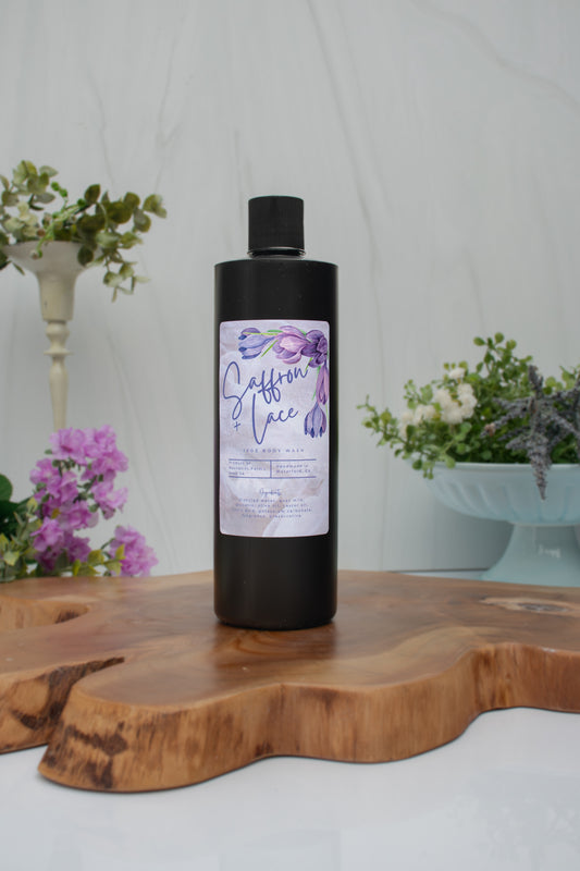 Saffron + Lace goat milk body wash by Mazzeltov Farms Soap Co. 16 oz black squeeze bottle with a warm amber, jasmine, and saffron fragrance.