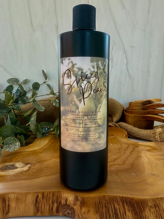 Spiced Pear goat milk body wash in black plastic squeeze bottle