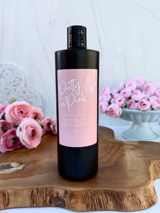 Pretty in Pink goat milk body wash by Mazzeltov Farms Soap Co. 16 oz black squeeze bottle with a soft floral scent of magnolia, pink jasmine, and warm amber.