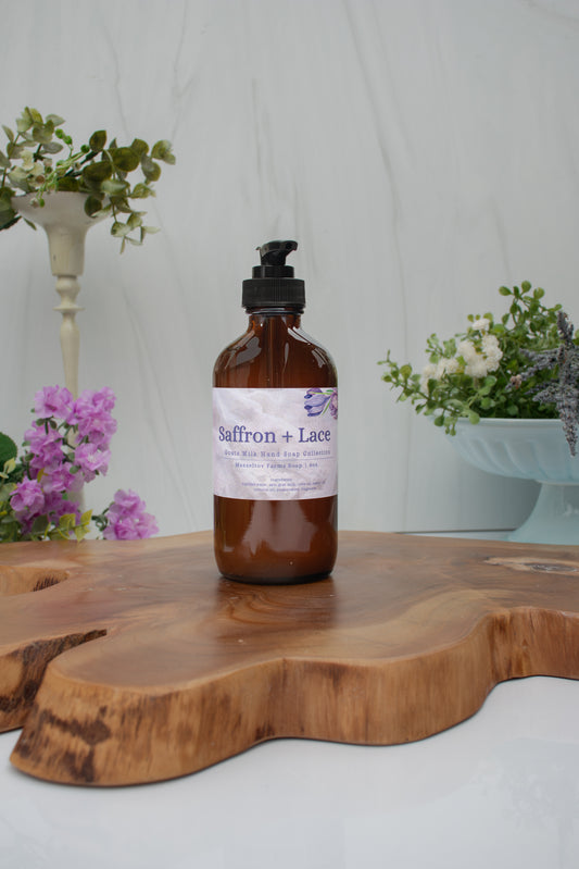 Saffron + Lace goat milk liquid hand soap in an 8 oz amber glass bottle with pump by Mazzeltov Farms Soap Co. Warm amber fragrance with jasmine, saffron, cedar, and oakmoss.