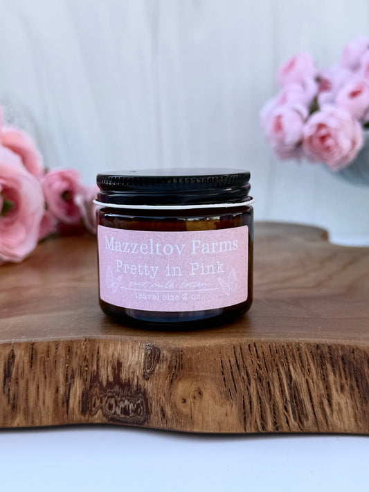 Pretty in Pink goat milk lotion in a 2 oz jar by Mazzeltov Farms Soap Co. Soft floral scent with magnolia, pink jasmine, and warm amber.
