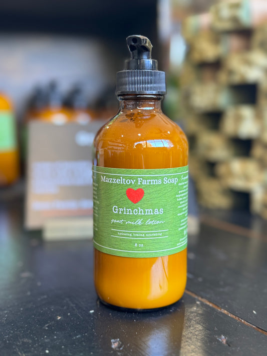 Grinchmas Goat Milk Lotion – peppermint and vanilla hydrating lotion in amber glass pump