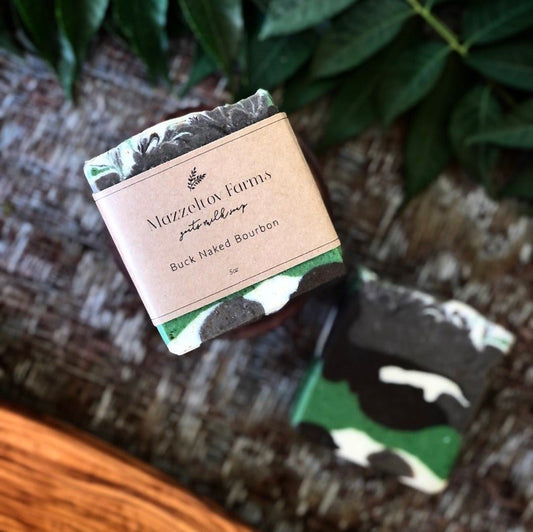 Bucknaked Bourbon goat milk soap bar handmade by Mazzeltov Farms Soap Co. Camouflage patterned bar with warm bourbon, leather, and oak notes.