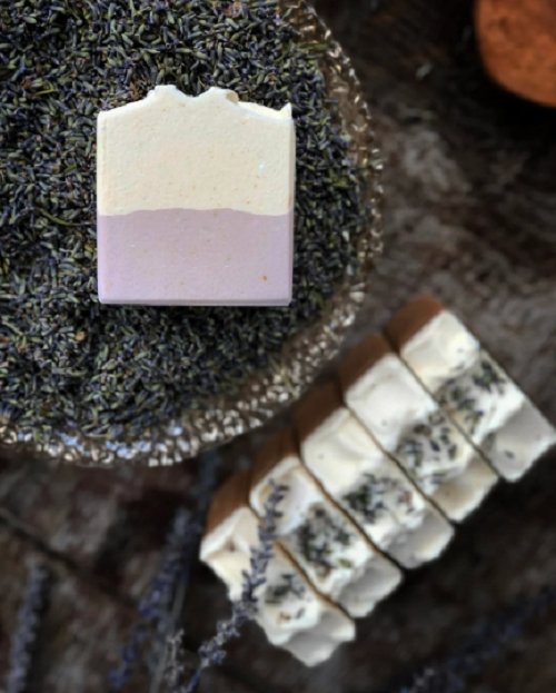 Lavender and cedar goat milk soap bar handmade by Mazzeltov Farms Soap Co. Creamy purple and white bar topped with lavender buds, scented with cedarwood and pine.