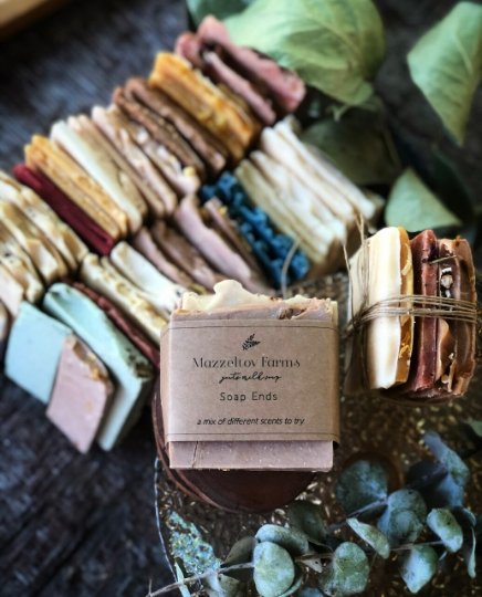 Soap End Sampler Pack from Mazzeltov Farms Soap Co. Bundle of assorted goat milk soap ends in various colors and scents, tied together as a sample gift set.